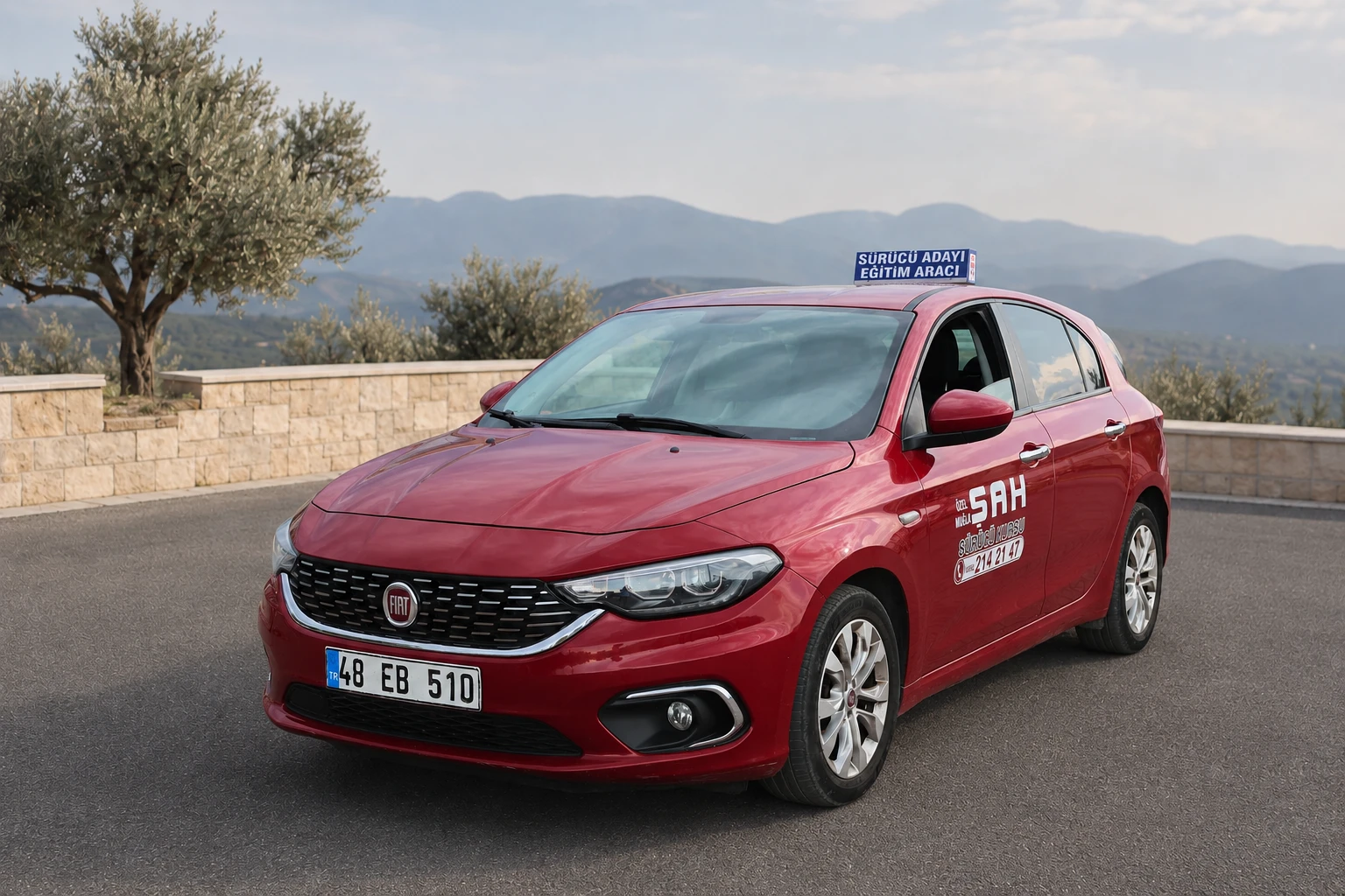 A red Fiat driver-training car from Şah Driving School